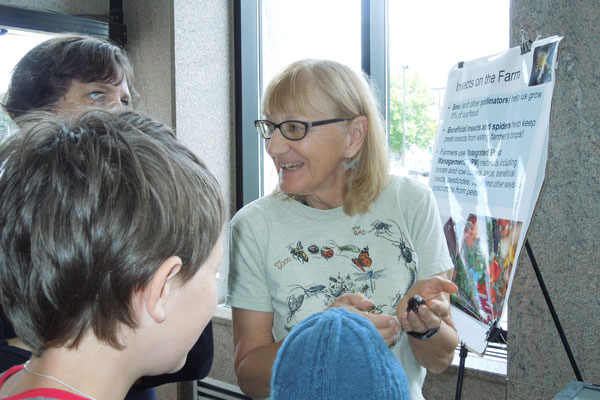 Kathy Murray using giant cockroaches to engage youth and families in learning about integrated pest management