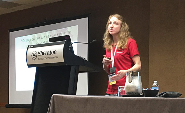 Susannah Reese presenting from behind a lectern